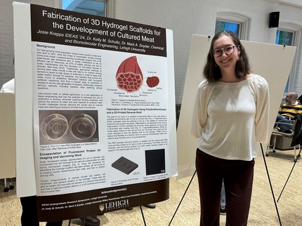 Josie Krepps '24 standing in front of her research poster.